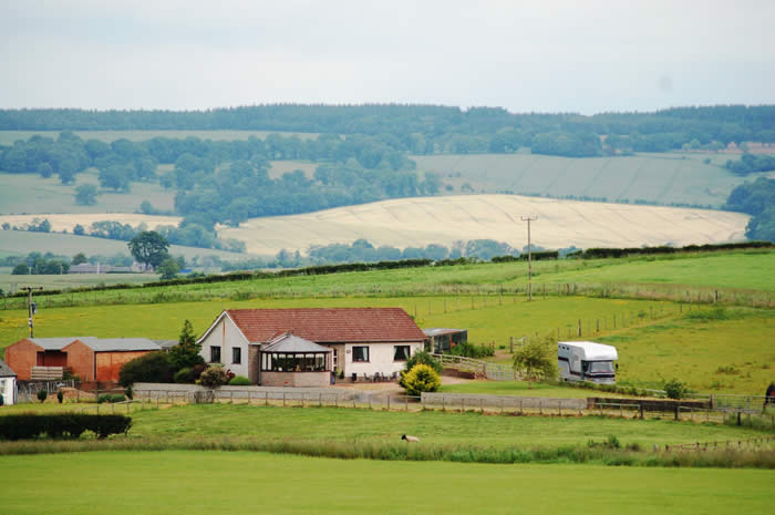 view of house and land